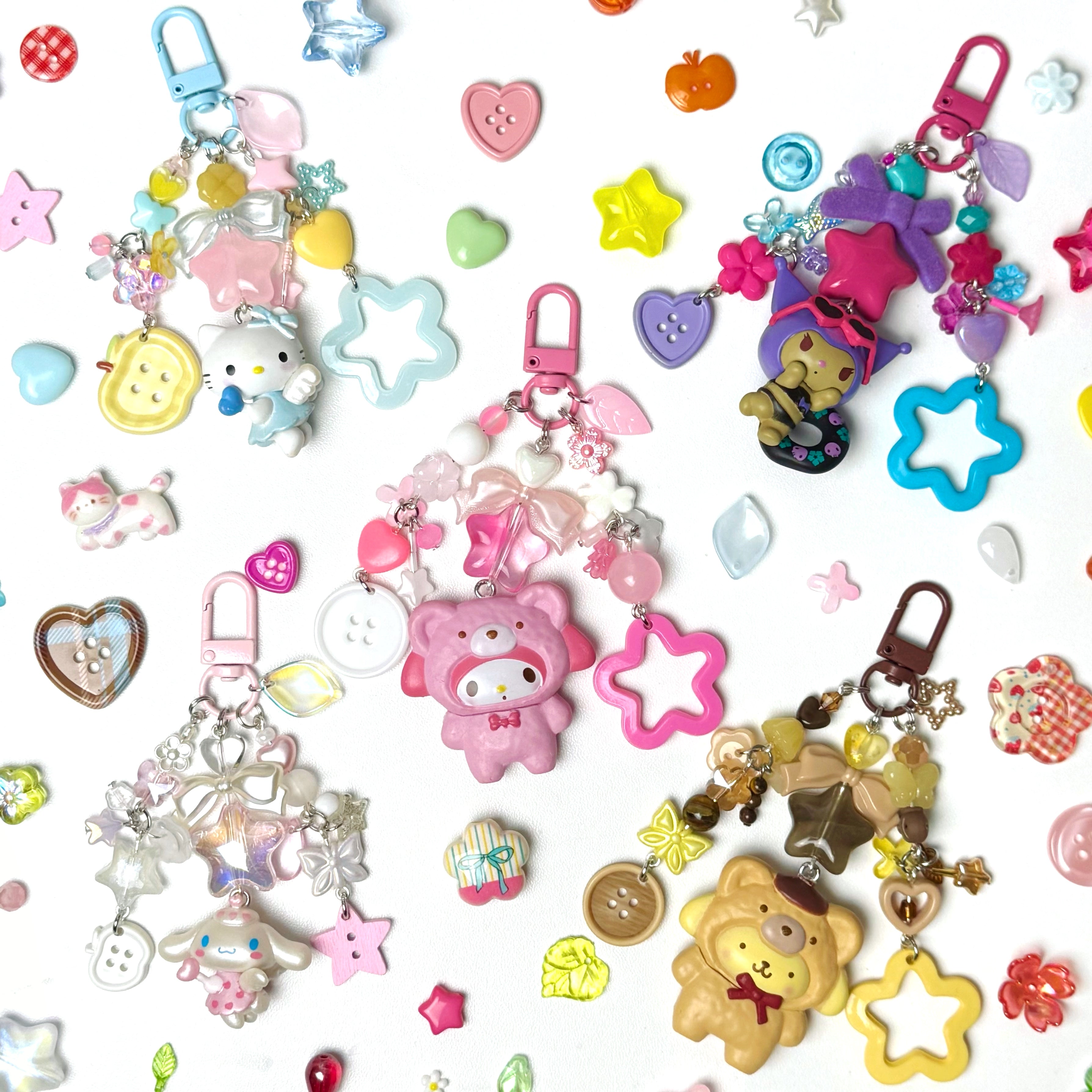Collection of colorful keychains and charms on a white background