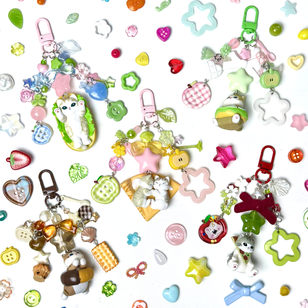 Collection of colorful keychains and charms on a white background