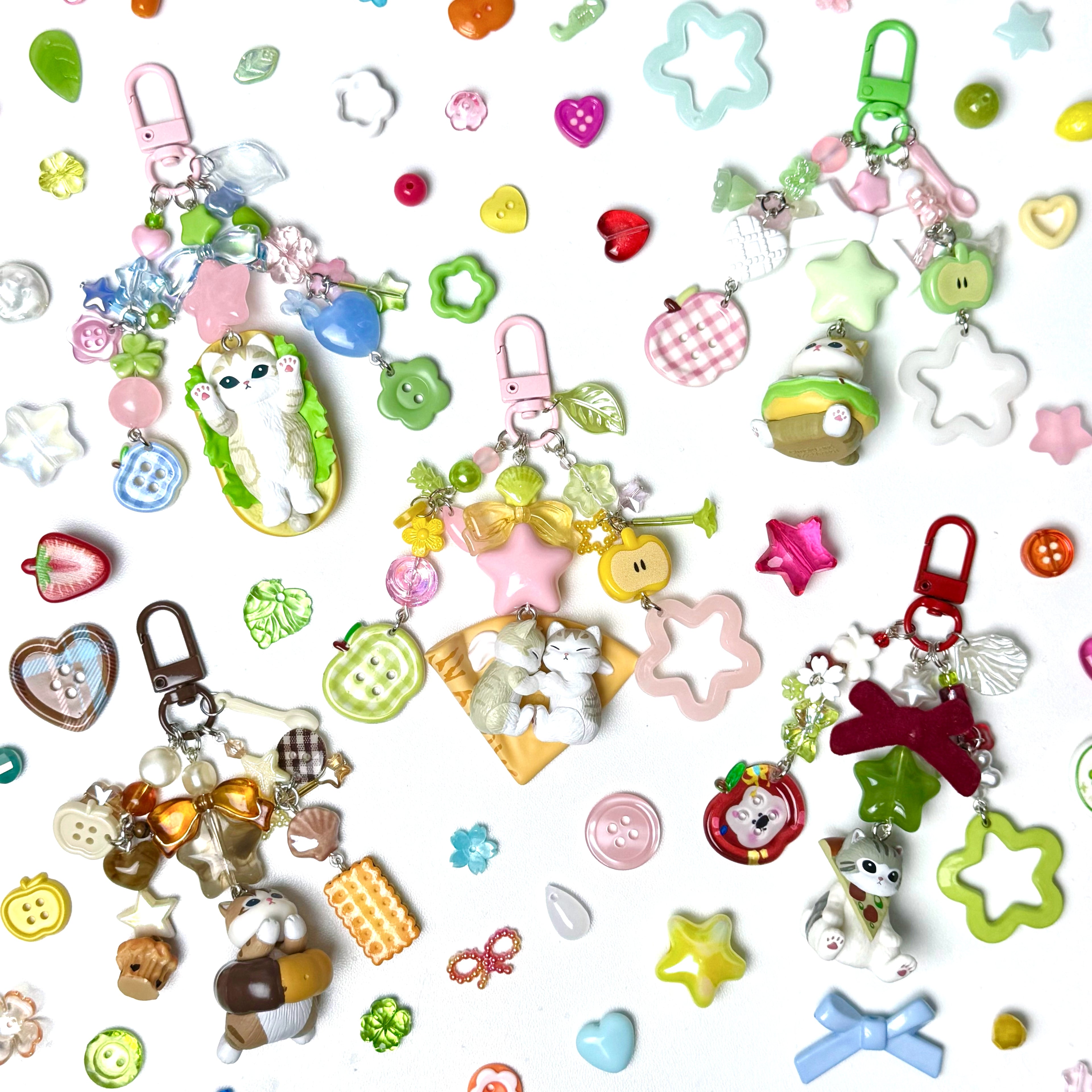 Collection of colorful keychains and charms on a white background