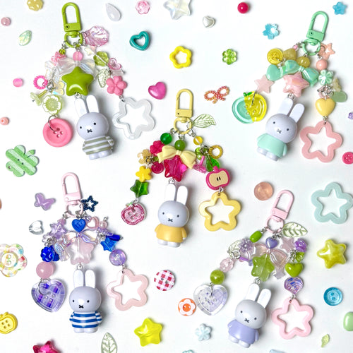 Colorful keychains with cartoon characters on a white background