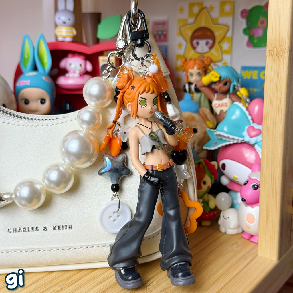 gi keychain on a purse; black, orange, white