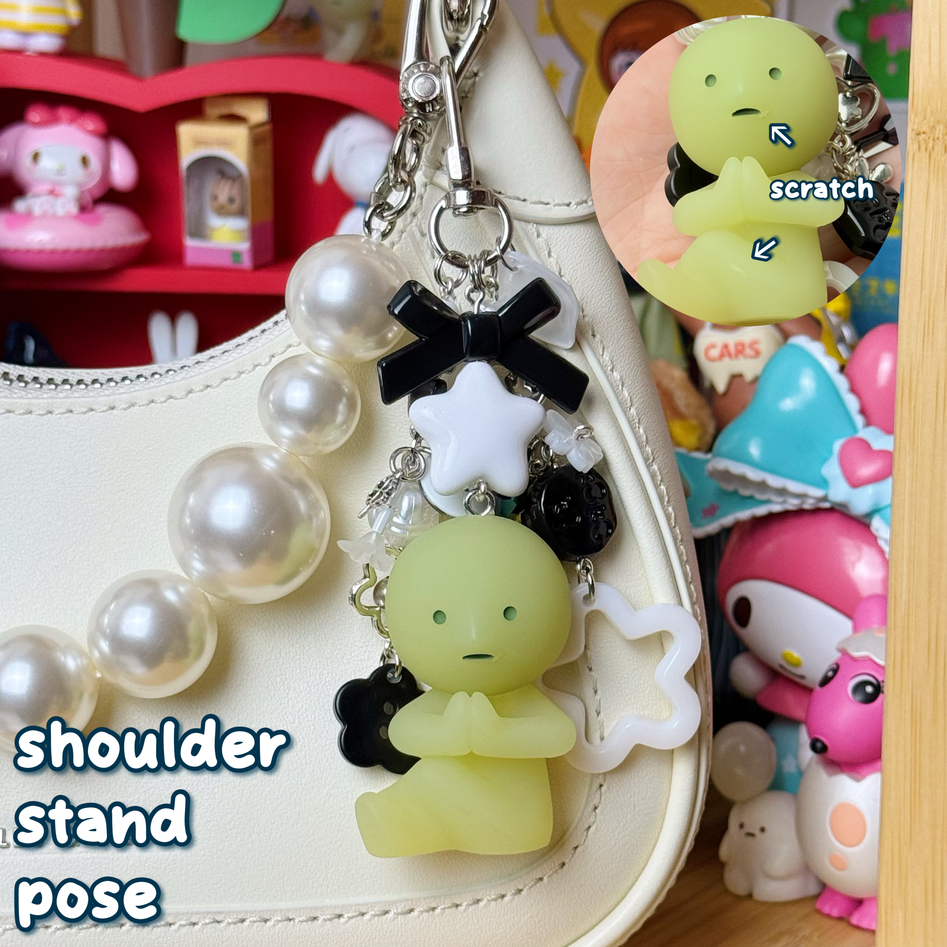 black, silver, & white shoulderstand pose smiski keychain with small scratches on face and leg