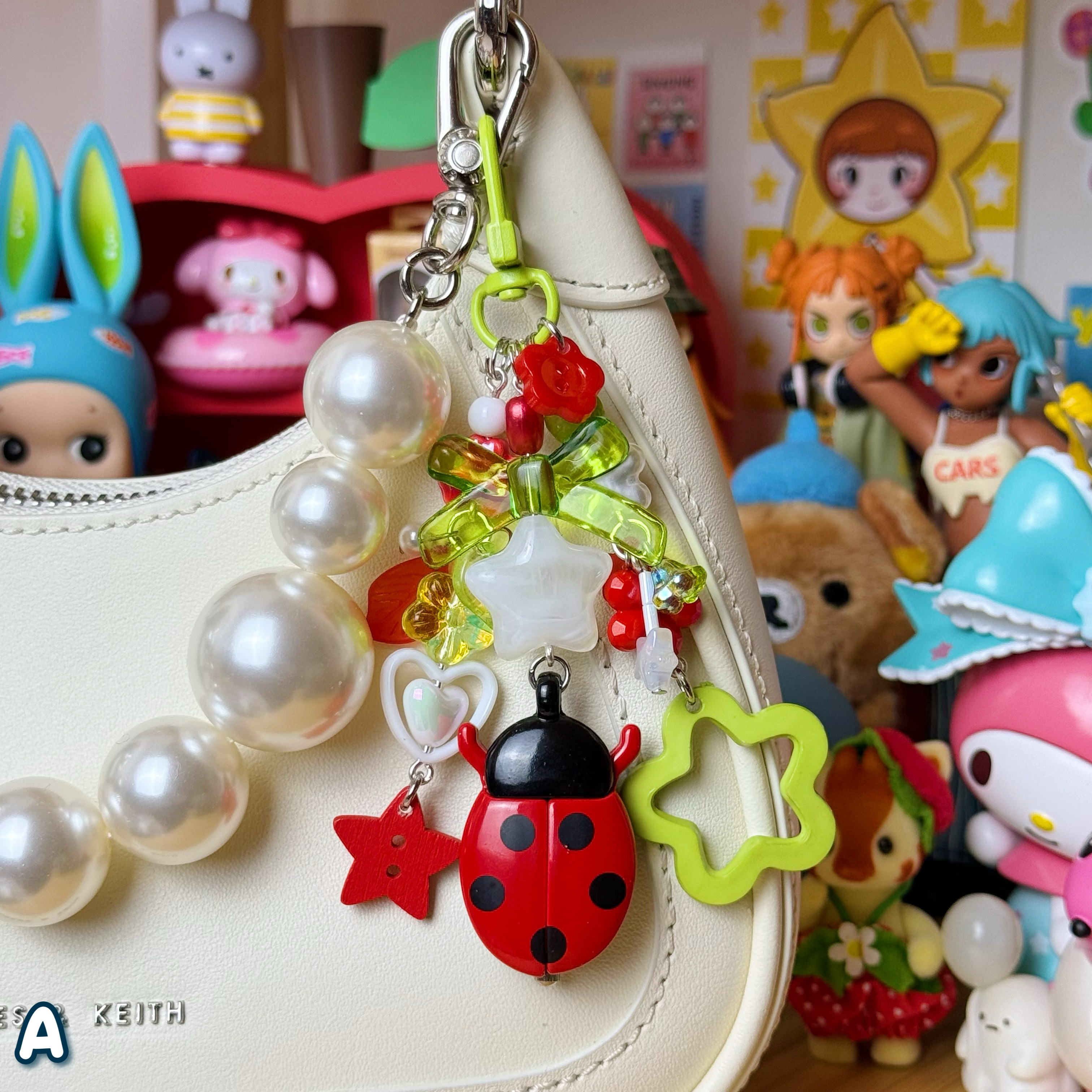 Red ladybug keychain, A