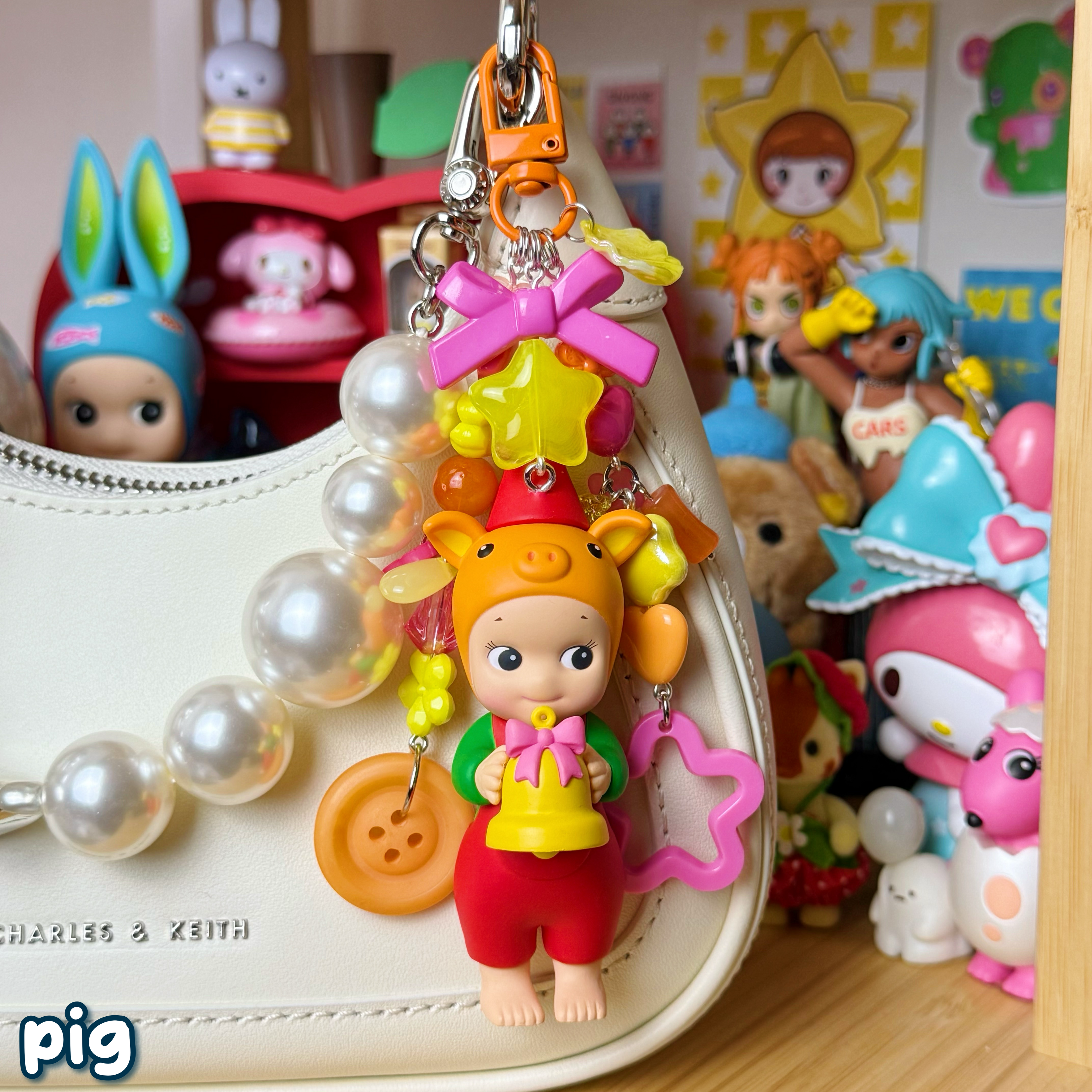 orange, hot pink, & yellow pig sonny angel keychain