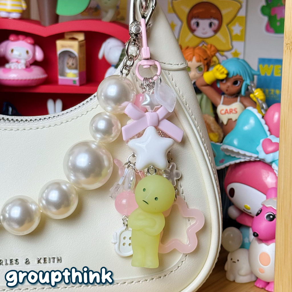 pink and white smiski keychain
