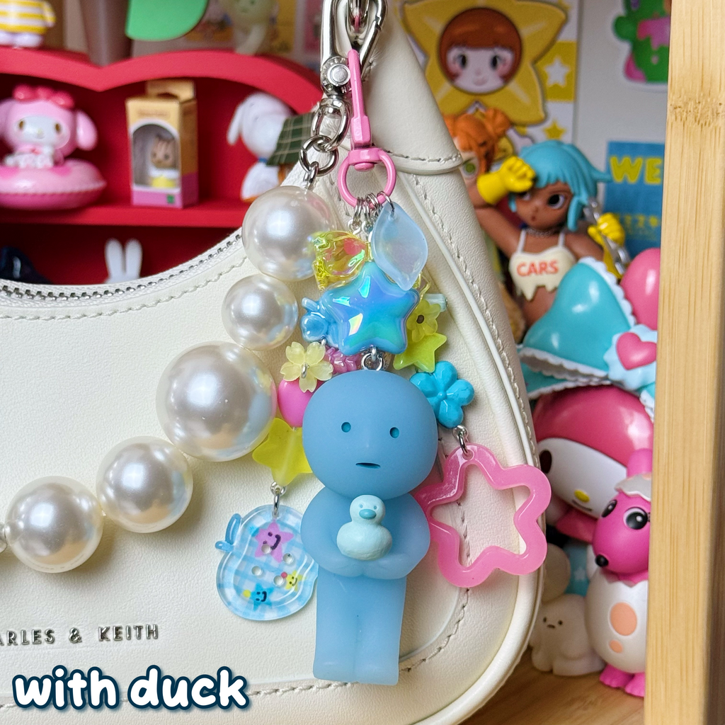 blue, yellow, & pink with duck smiski keychain