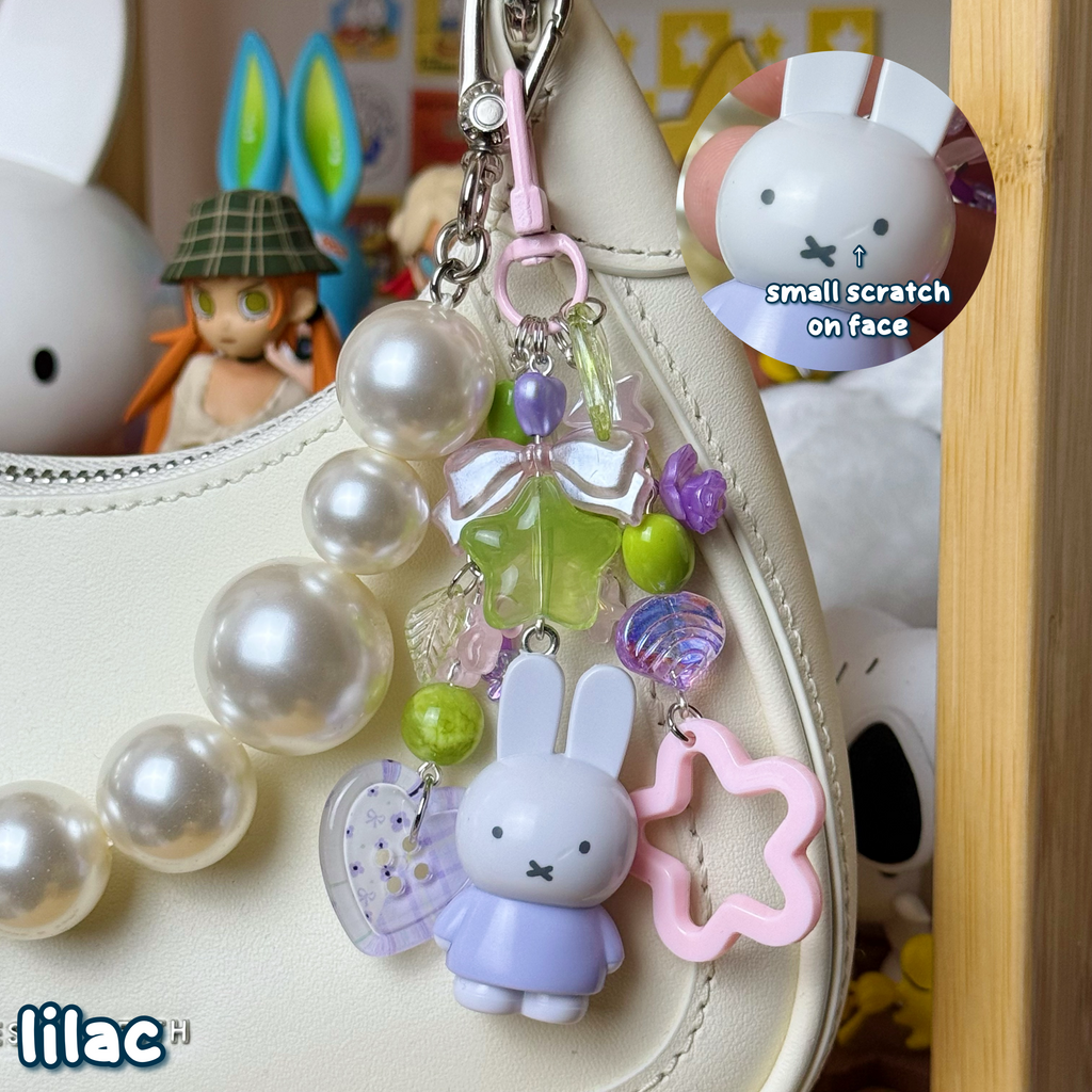 lilac, green, & pink bunny keychain, has small scratch on face